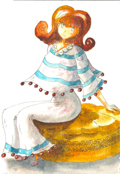 Une coquette rousse habillée de bleu et blanc pose sur son pouf.