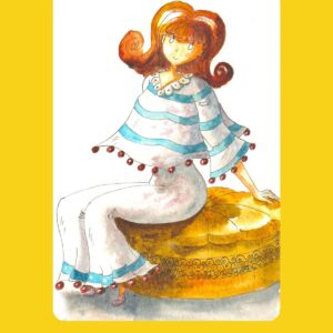 Une coquette rousse habillée de bleu et blanc pose sur son pouf.